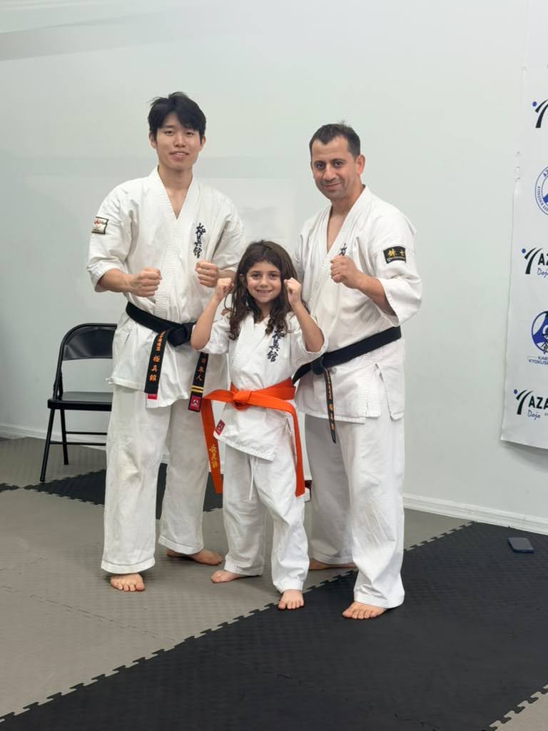 A young student with her instructors