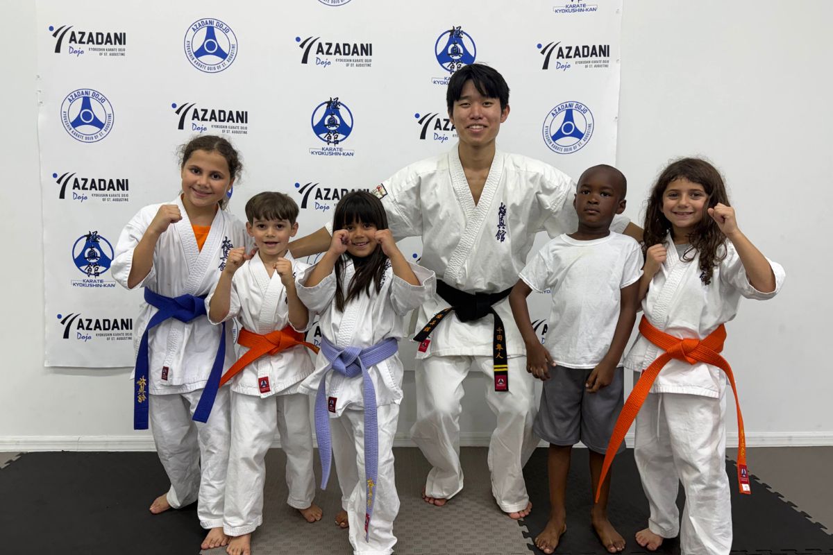 Young students with their instructors at Azadani Dojo